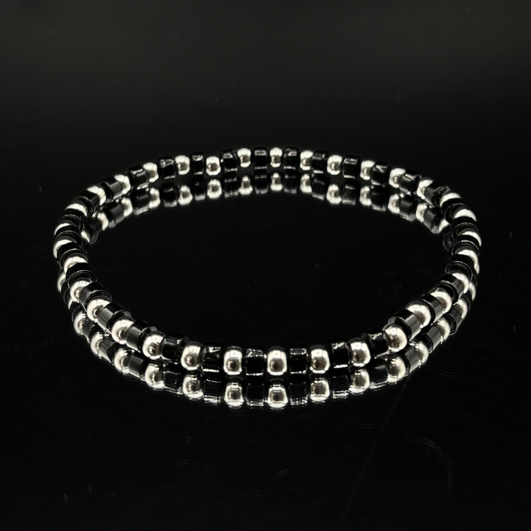 Pulsera de hombre en ágata negra y acero: elegancia y fuerza.